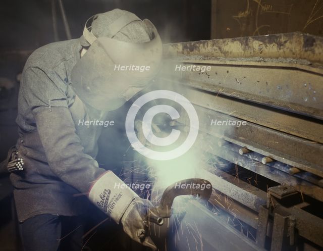 Welder making boilers for a ship, Combustion Engineering Co., Chattanooga, Tenn., 1942. Creator: Alfred T Palmer.