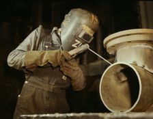 Welder making boilers for a ship, Combustion Engineering Co., Chattanooga, Tenn., 1942. Creator: Alfred T Palmer