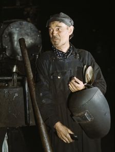 Welder at the C & NW RR locomotive shops, 40th Street shops, Chicago, Ill., 1942. Creator: Jack Delano