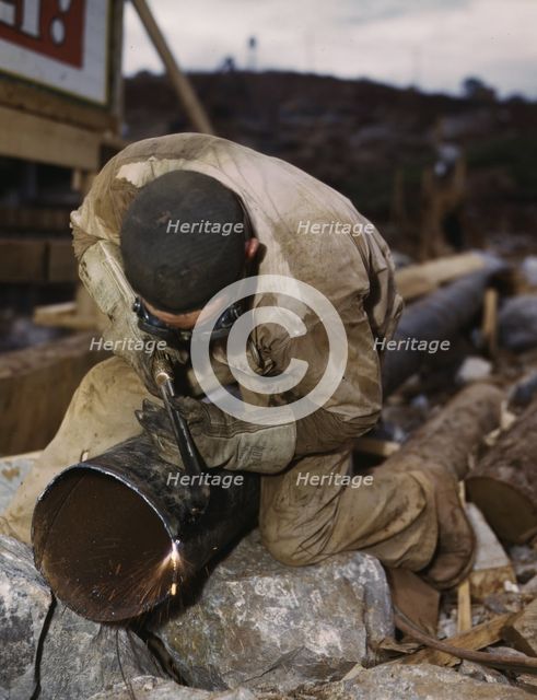 Welder at work on Douglas Dam, Tenn. (TVA), 1942. Creator: Alfred T Palmer.