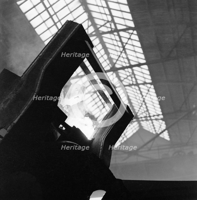 Welder working at the Landsverk factory, Landskrona, Sweden, 1957. Creator: Unknown.
