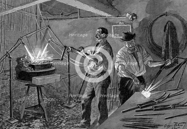 Welding a bicycle frame, France, 1896.  Creator: Unknown.