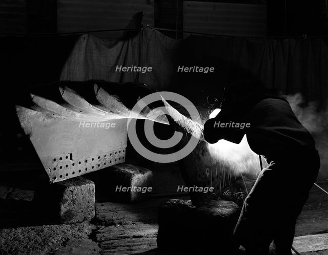 Welding a dragline bucket, Edgar Allen Steel Co, Sheffield, South Yorkshire, 1962. Creator: Michael Walters.