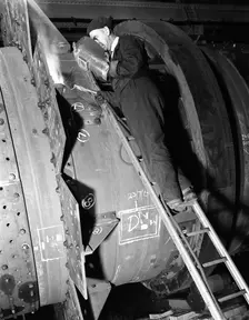 Welding an industrial drying unit, Edgar Allen Steel Co, Sheffield, South Yorkshire, 1962. Creator: Michael Walters