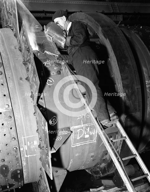 Welding an industrial drying unit, Edgar Allen Steel Co, Sheffield, South Yorkshire, 1962. Artist: Michael Walters