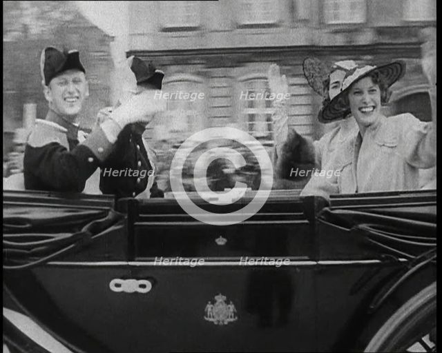 Well Dressed Men and Women Riding in a Car, 1930s. Creator: British Pathe Ltd.
