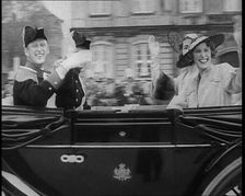 Well Dressed Men and Women Riding in a Car, 1930s. Creator: British Pathe Ltd
