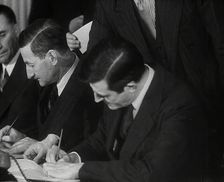 Wendell Willkie Signing an Agreement Allowing the USA to use British Naval Bases..., 1941. Creator: British Pathe Ltd