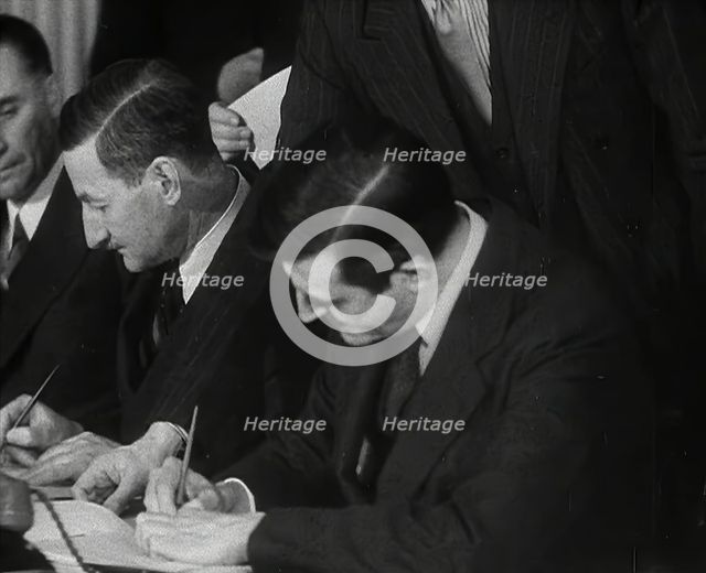 Wendell Willkie Signing an Agreement Allowing the USA to use British Naval Bases..., 1941. Creator: British Pathe Ltd.