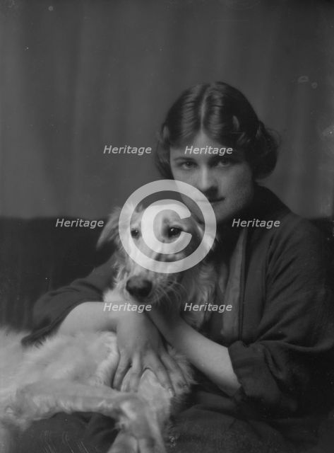 Wessell, Miss (Mrs. A.L. Cochrane), or Mrs. Meyer D. Rothchild, with dog, portrait..., 1916 or 1917. Creator: Arnold Genthe.