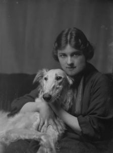 Wessell, Miss (Mrs. A.L. Cochrane), or Mrs. Meyer D. Rothchild, with dog, portrait..., 1916 or 1917. Creator: Arnold Genthe