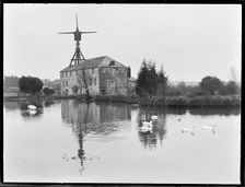 West Ashling Mill from north-west across the mill pond, Mill Road, Funtington, West Sussex, 1920-50. Creator: George R Long
