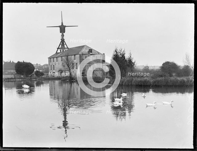 West Ashling Mill from north-west across the mill pond, Mill Road, Funtington, West Sussex, 1920-50. Creator: George R Long.