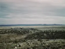 West-bound passenger train going around a curve on the Atchison..., near Gleed, Arizona, 1943. Creator: Jack Delano