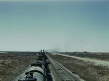 West bound Santa Fe R.R. freight train stopping for water, Tolar, New Mexico, 1943. Creator: Jack Delano