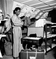 West Indian arrivals living in a shelter underneath Clapham South Tube station, London, 1950s. Creator: Henry Grant
