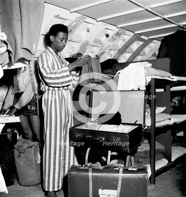 West Indian arrivals living in a shelter underneath Clapham South Tube station, London, 1950s.  Creator: Henry Grant.