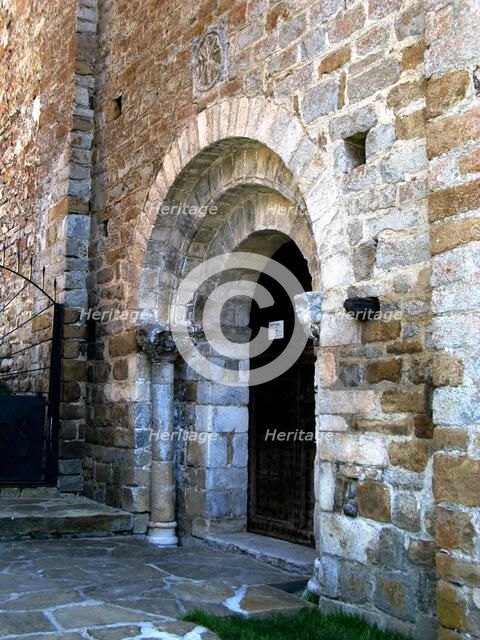 West Portal of the church of Santa Maria in Cap d'Aran Tredós, the portal has three round arches …