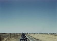 Westbound freight train stopping for water, Melrose, New Mexico, 1943. Creator: Jack Delano