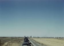 Westbound freight train stopping for water, Melrose, New Mexico, 1943. Creator: Jack Delano