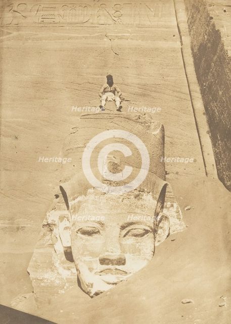 Westernmost Colossus of the Temple of Re, Abu Simbel, 1850. Creator: Maxime du Camp.