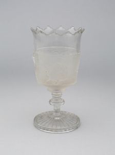 Westward Ho!/Pioneer pattern goblet on pedestal, c. 1876. Creator: Gillinder & Sons