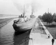 Whaleback entering Weitzel Lock, Sault Sainte Marie, Mich., between 1900 and 1910. Creator: Unknown