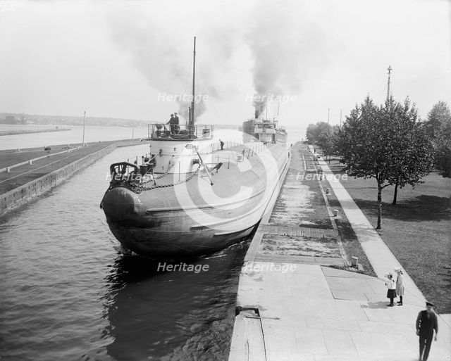 Whaleback entering Weitzel Lock, Sault Sainte Marie, Mich., between 1900 and 1910. Creator: Unknown.