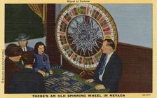 Wheel of Fortune. There's an Old Spinning Wheel in Nevada postcard, 1940