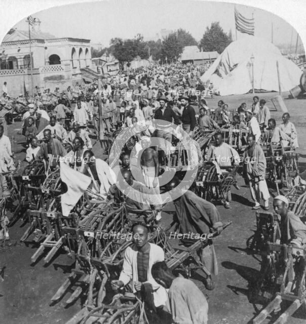 'Wheelbarrow transportation at the boat landing', Tientsin (Tianjin), China, 1901. Artist: Underwood & Underwood