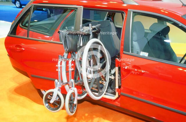 Wheelchair access into car. Artist: Unknown.