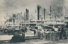 When Cotton Was Loaded, a forest of derricks and smoke-stacks 1937