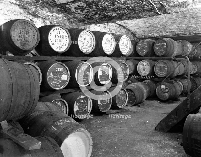Whisky in barrels at a bonded warehouse, Sheffield, South Yorkshire, 1960.  Artist: Michael Walters