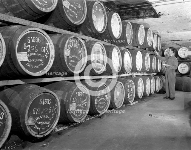 Whiskey blending at Wiley & Co, a Sheffield bonded warehouse, South Yorkshire, 1960. Creator: Michael Walters.