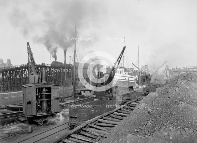 Whirleys unloading ore, Penna. R.R. [Pennsylvania Railroad] docks, Erie, Pa., ca 1900. Creator: William H. Jackson.