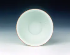 White glazed bowl with moulded design of dragons and carp, Qing dynasty, China, 1650-1670. Creator: Unknown