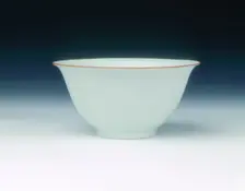 White glazed bowl with moulded design of dragons and carp, Qing dynasty, China, 1650-1670. Creator: Unknown