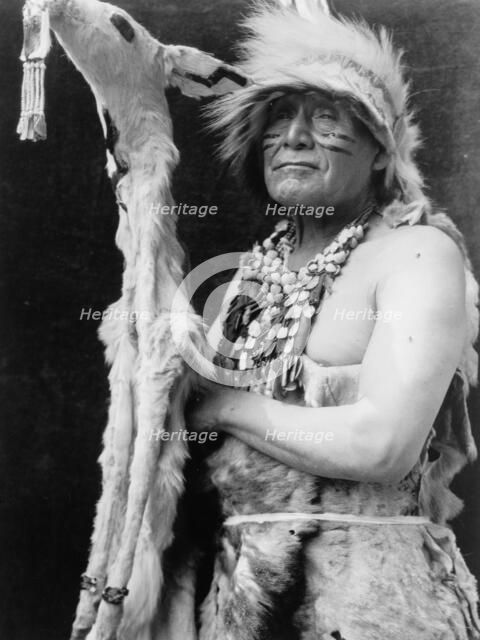 White deerskin dance costume-Hupa, c1923. Creator: Edward Sheriff Curtis.