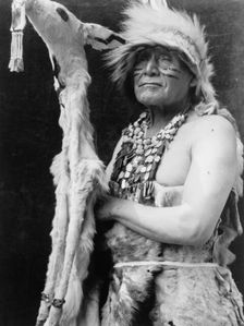 White deerskin dance costume-Hupa, c1923. Creator: Edward Sheriff Curtis