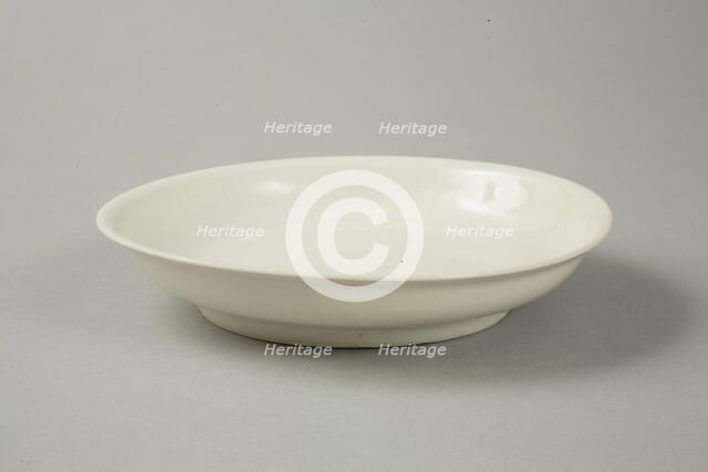 White dish with anhua design of two phoenix and cloud scroll design, Song dynasty, c.1300. Artist: Unknown.