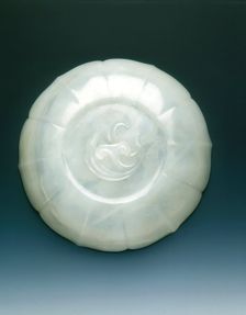 White jade bracketed saucer with two catfish and fungus in relief, Qing dynasty, mid 18th century