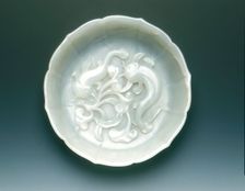 White jade bracketed saucer with two catfish and fungus in relief, Qing dynasty, mid 18th century