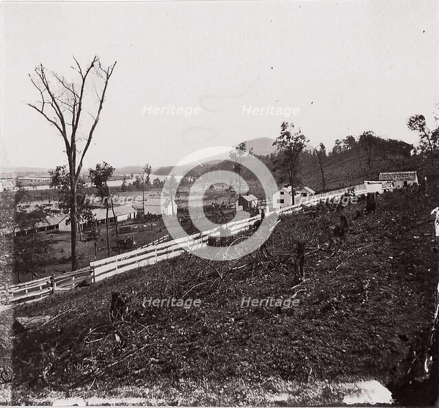 [White picket fence with buildings in background]. Brady album, p. 123, 1861-65. Creator: Unknown.