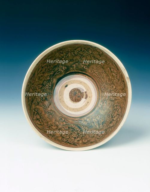 White rimmed celadon bowl with moulded peony scrolls, Jin dynasty, China, 13th century. Creator: Unknown.