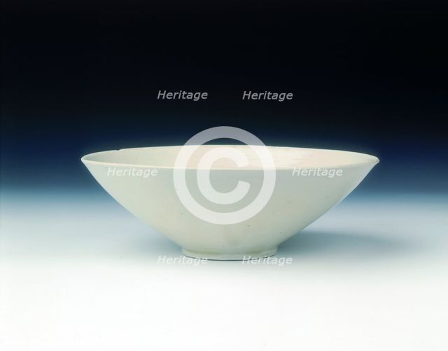 White ware bowl with moulded twin fish and floral pattern, Jin dynasty, China, 12th century. Creator: Unknown.