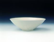 White ware bowl with moulded twin fish and floral pattern, Jin dynasty, China, 12th century. Creator: Unknown