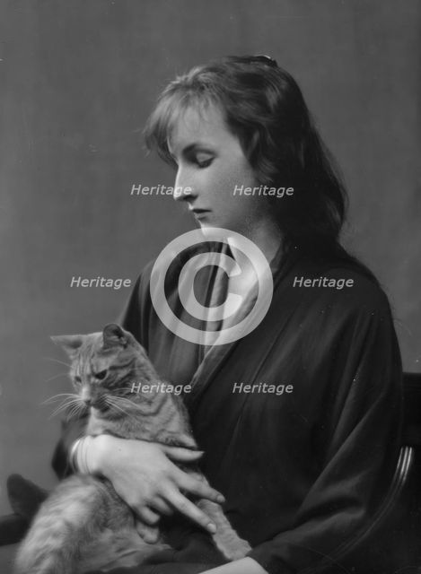 Whittaker, Miss, with Buzzer the cat, portrait photograph, 1916. Creator: Arnold Genthe.