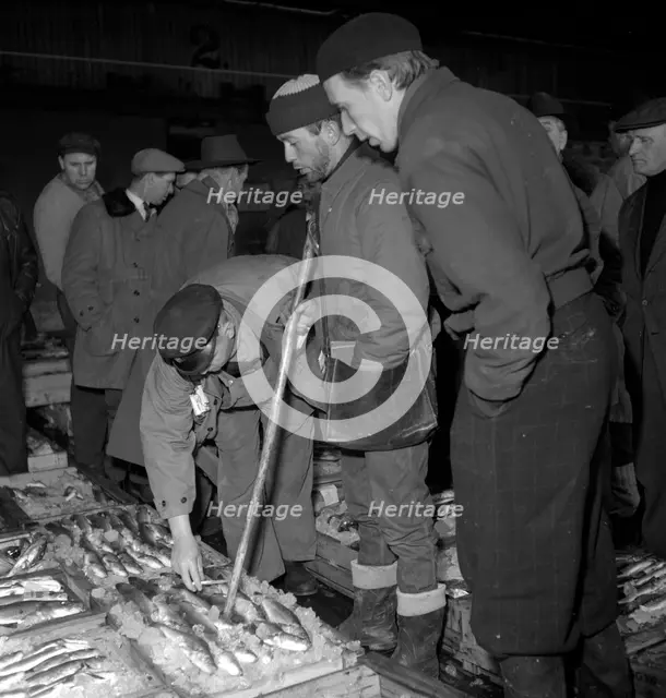 Wholesalers and fishmongers at the fish auction, Gothenburg, Sweden, 1960. Creator: Torkel Lindeberg.