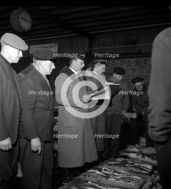 Wholesalers and fishmongers at the fish auction, Gothenburg, Sweden, 1960. Artist: Torkel Lindeberg