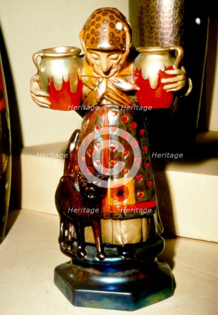 Witch and Cat: Pottery figure from Pecs, Hungary. 19th century. Artist: Unknown.